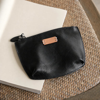 Black vegetable-tanned top-grain leather cosmetic pouch