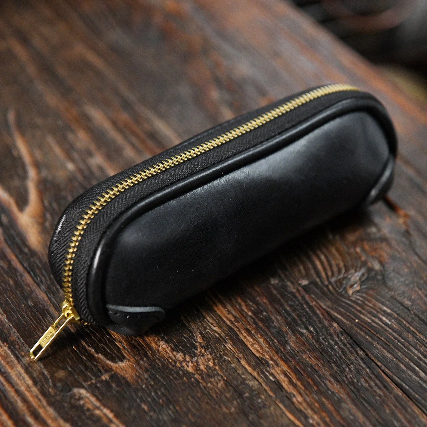 Black vegetable-tanned leather zipper pencil case