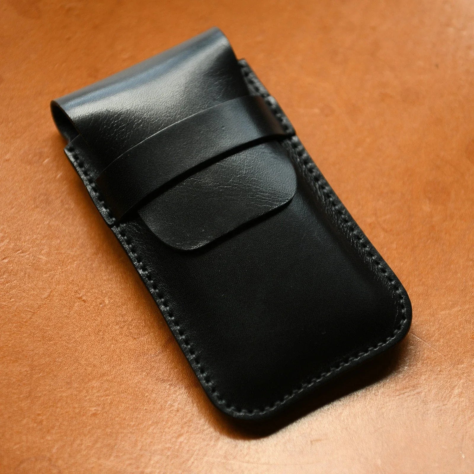 Black hand-stitched leather watch pouch