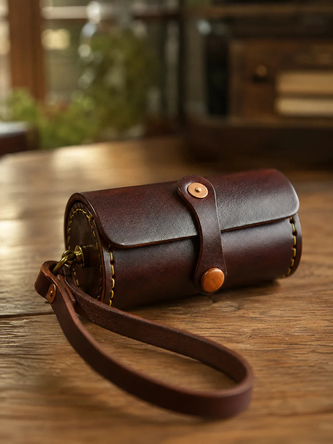 Vintage brown cowhide wristlet case with detachable loop strap