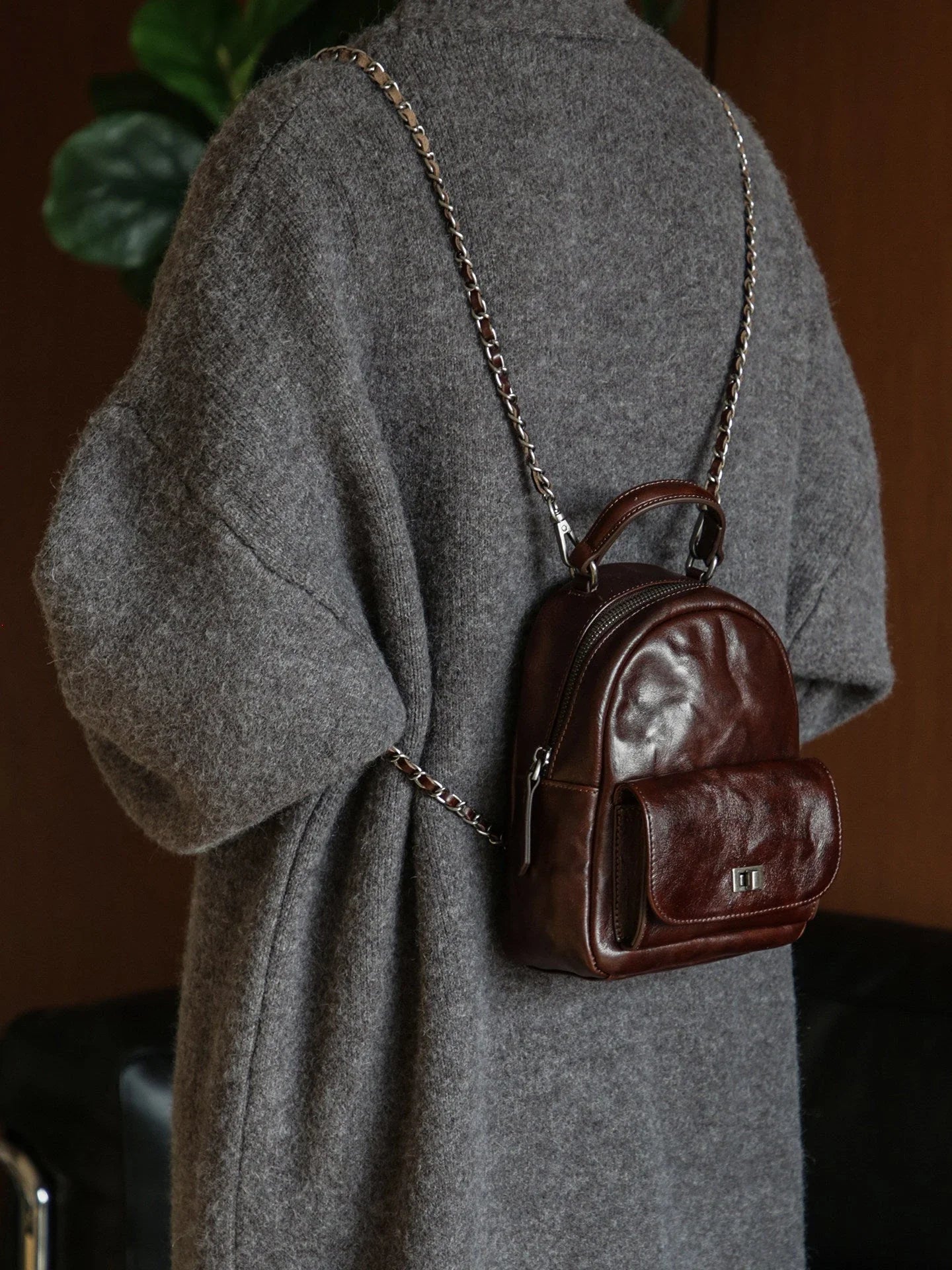 Back view of the ebony brown vegetable-tanned leather mini backpack