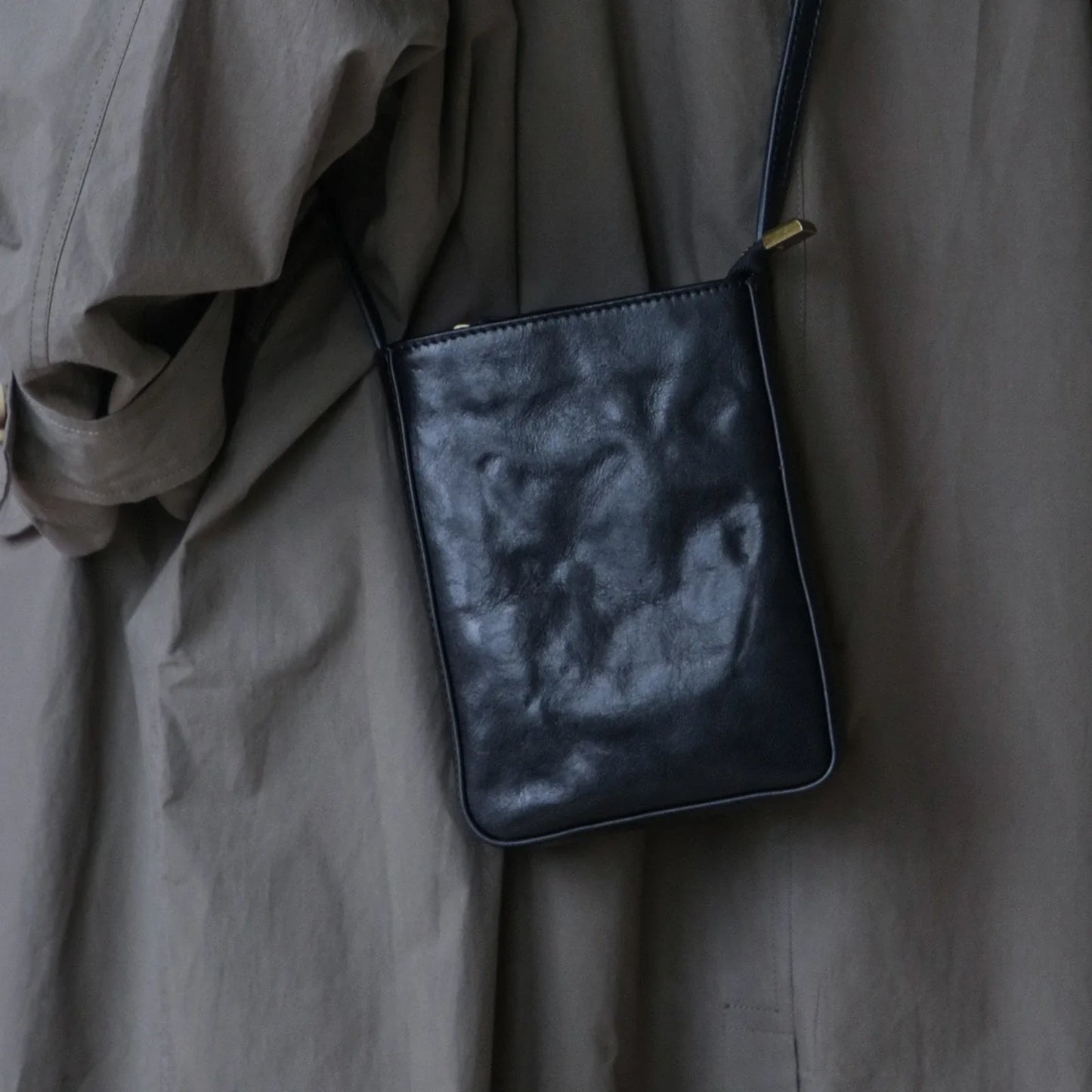 Black leather phone crossbody bag, rear styling view
