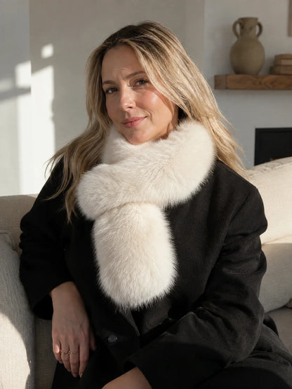 Woman styling a Cream Ivory fox fur scarf with a black coat