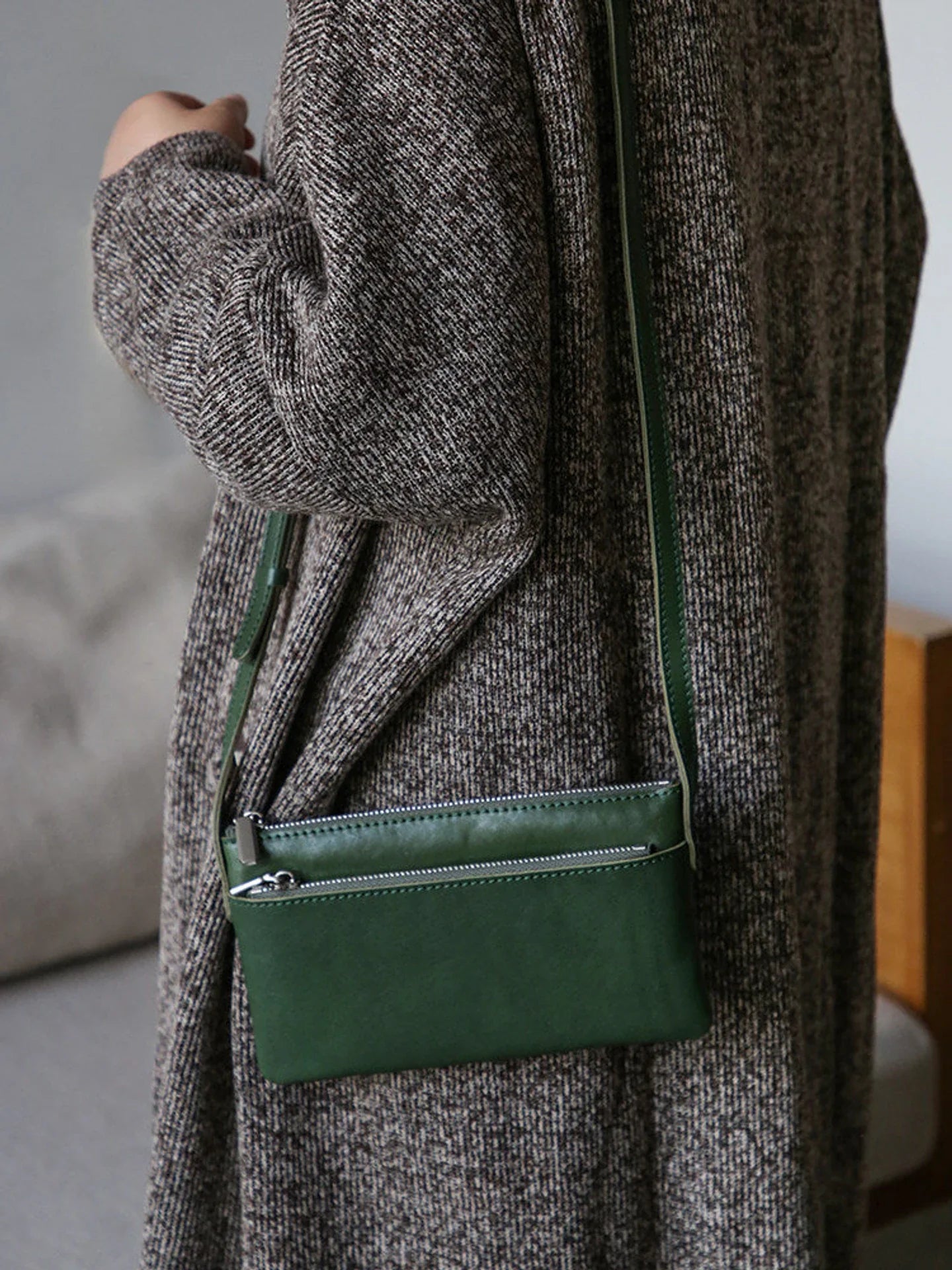 Forest green leather phone bag with exterior zipper pocket
