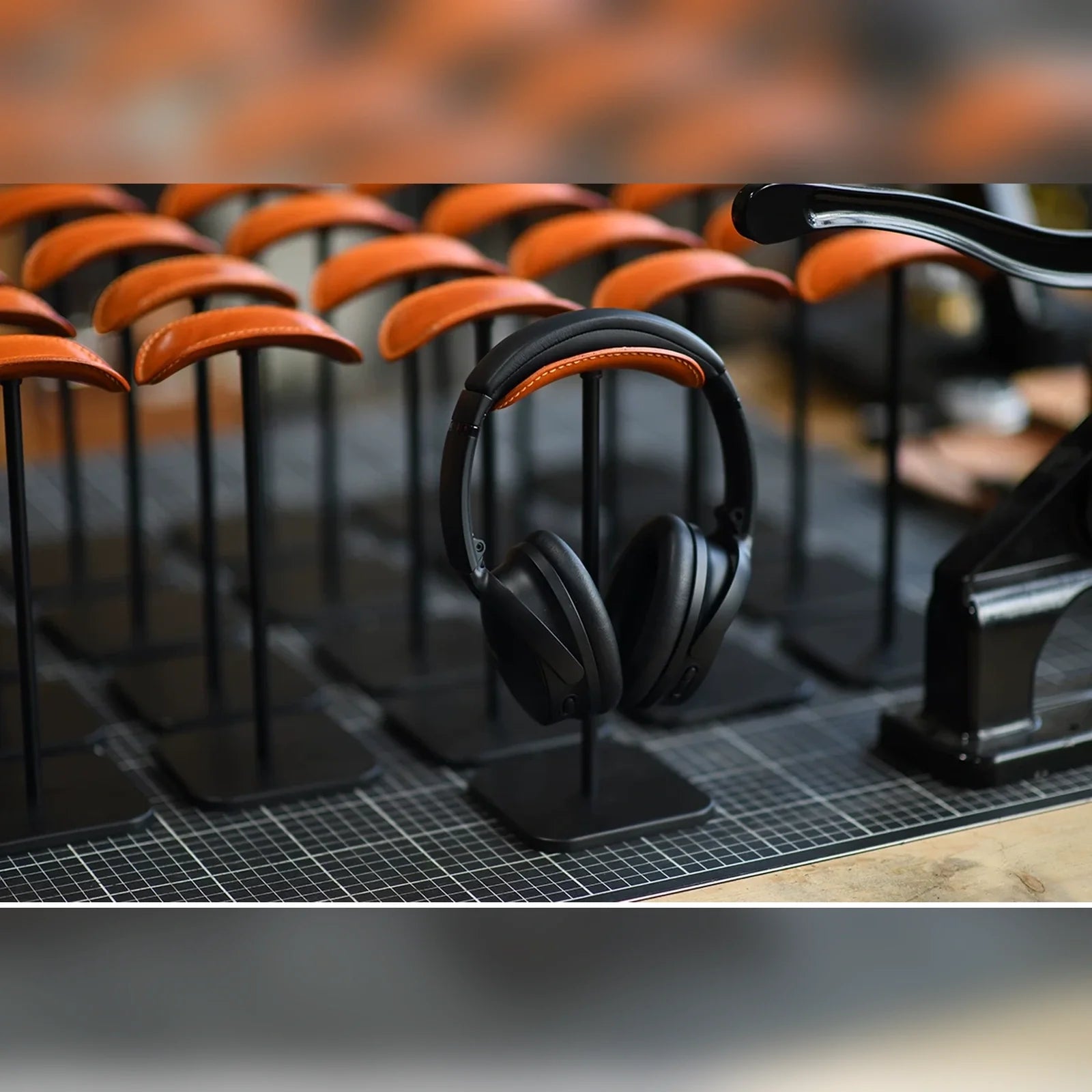 Handcrafted cowhide headphone stands in workshop display