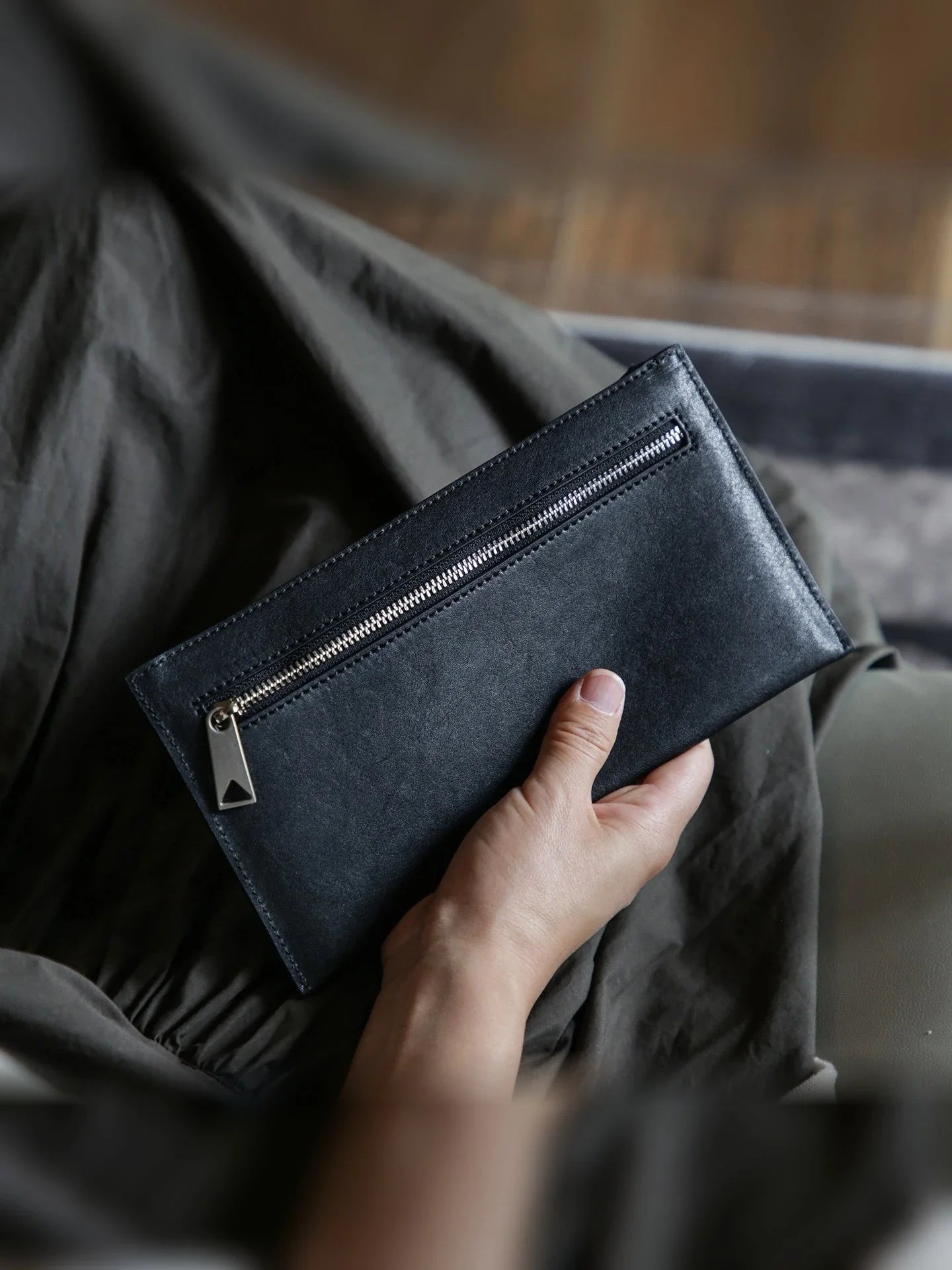 Black vegetable-tanned leather slim long wallet with exterior zip pocket