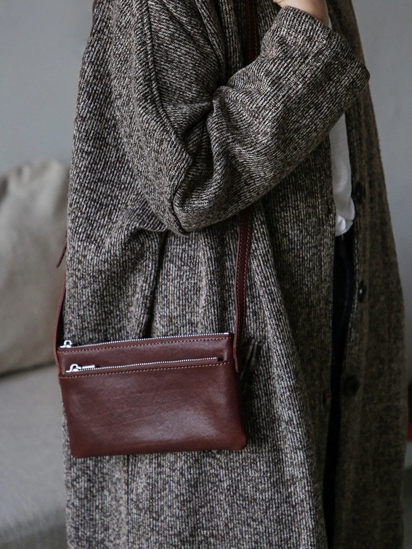 Coffee brown leather phone bag with exterior zipper pocket