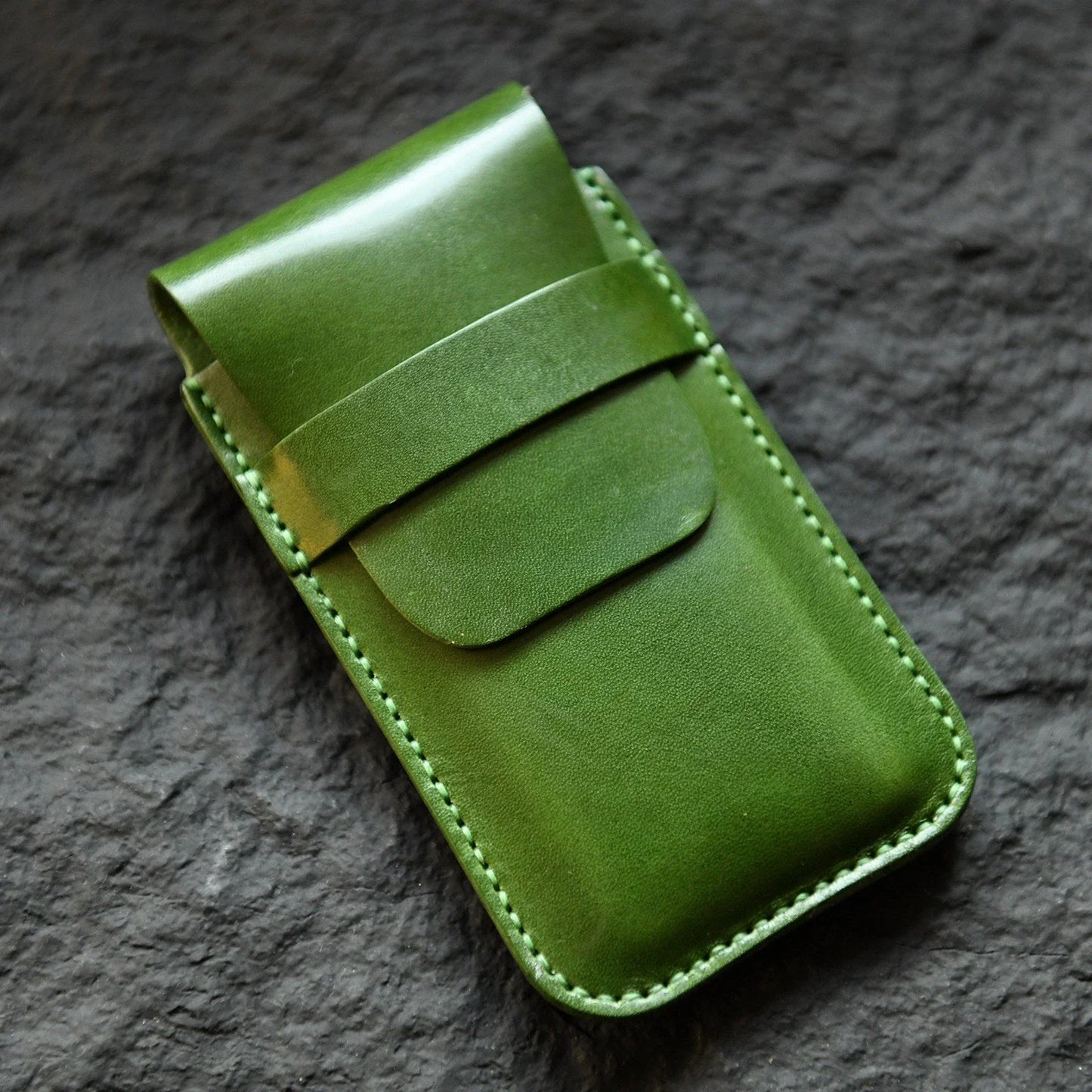 Green hand-stitched leather watch pouch