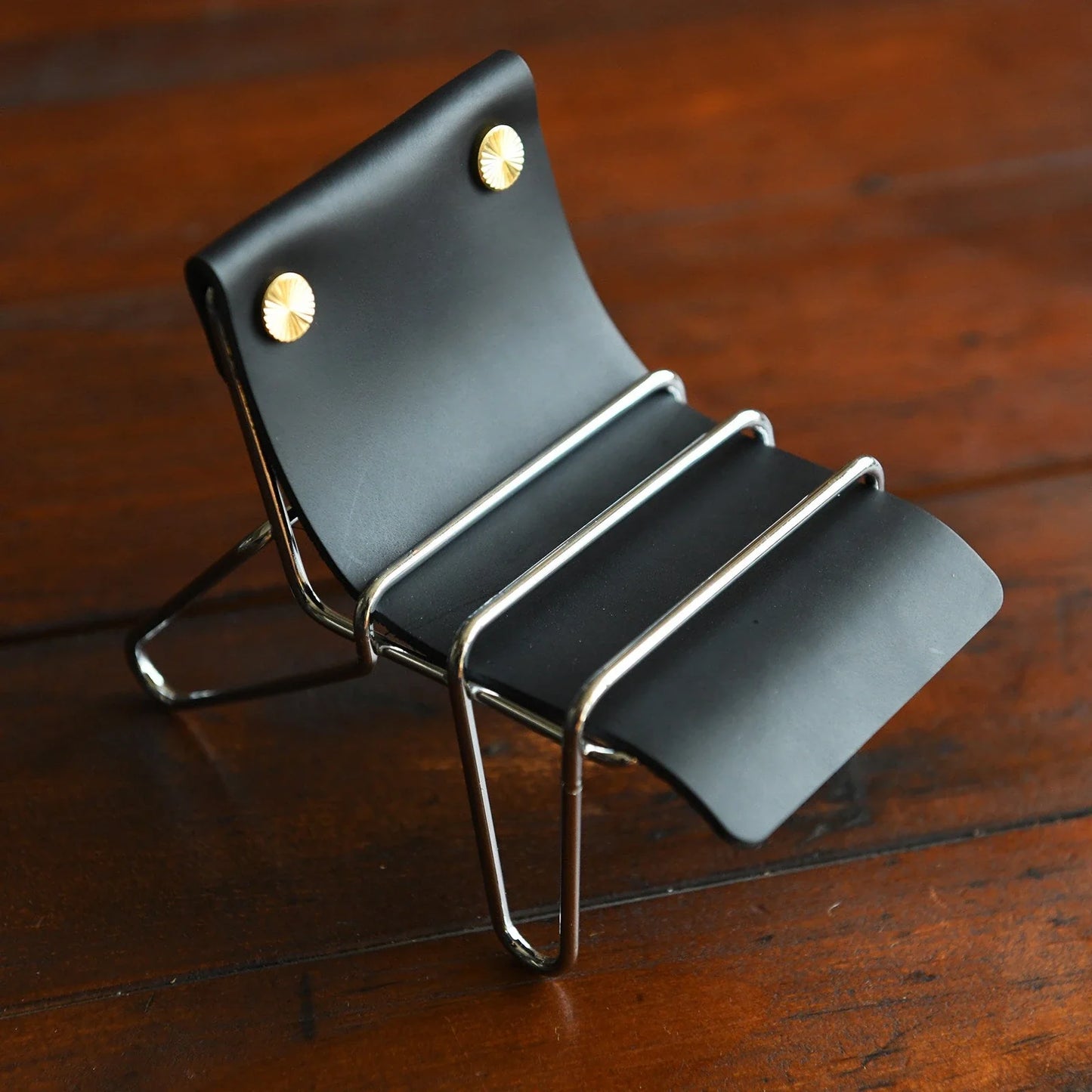 Black leather phone stand with silver frame