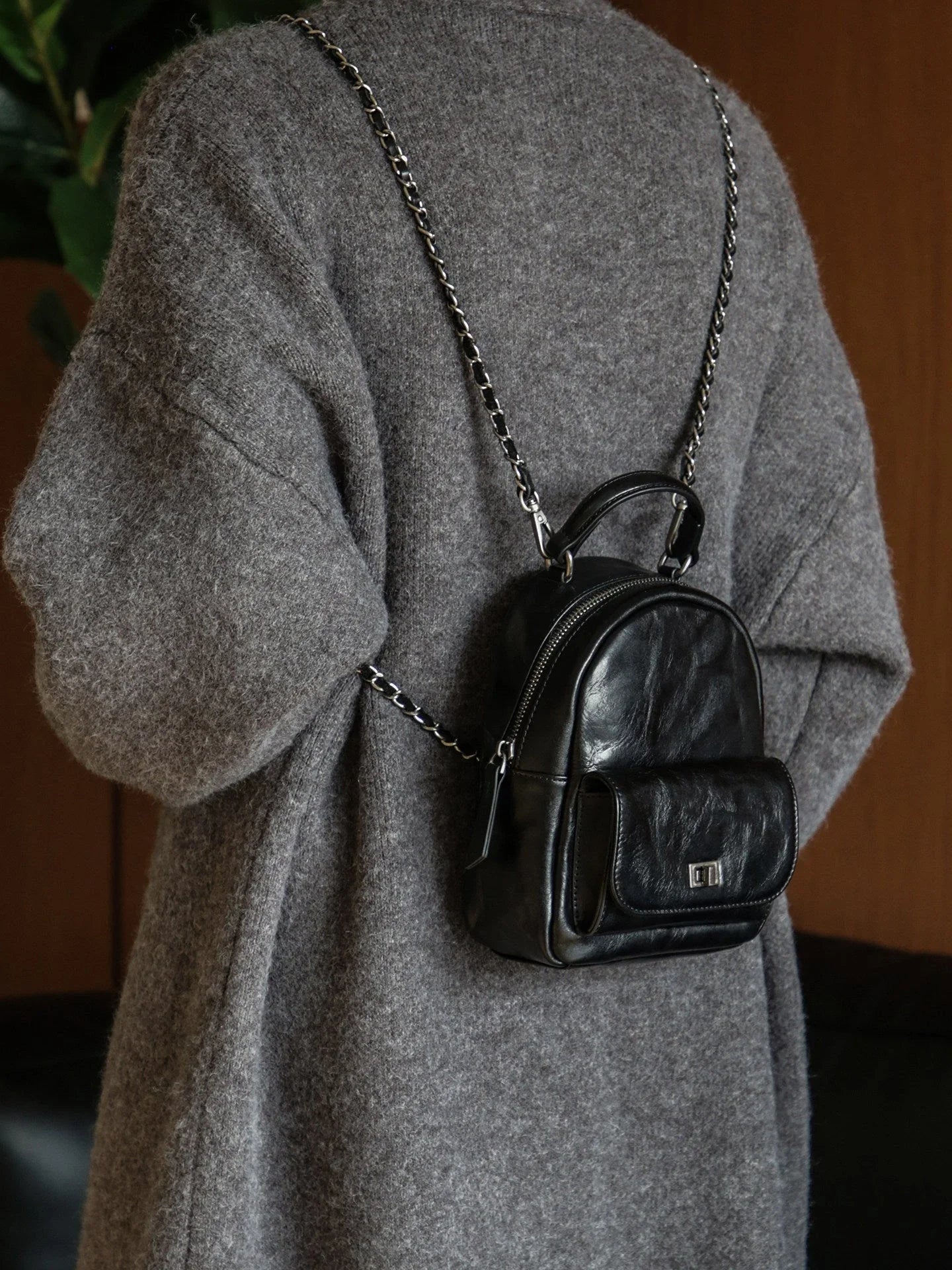 Back view of the black vegetable-tanned leather mini backpack