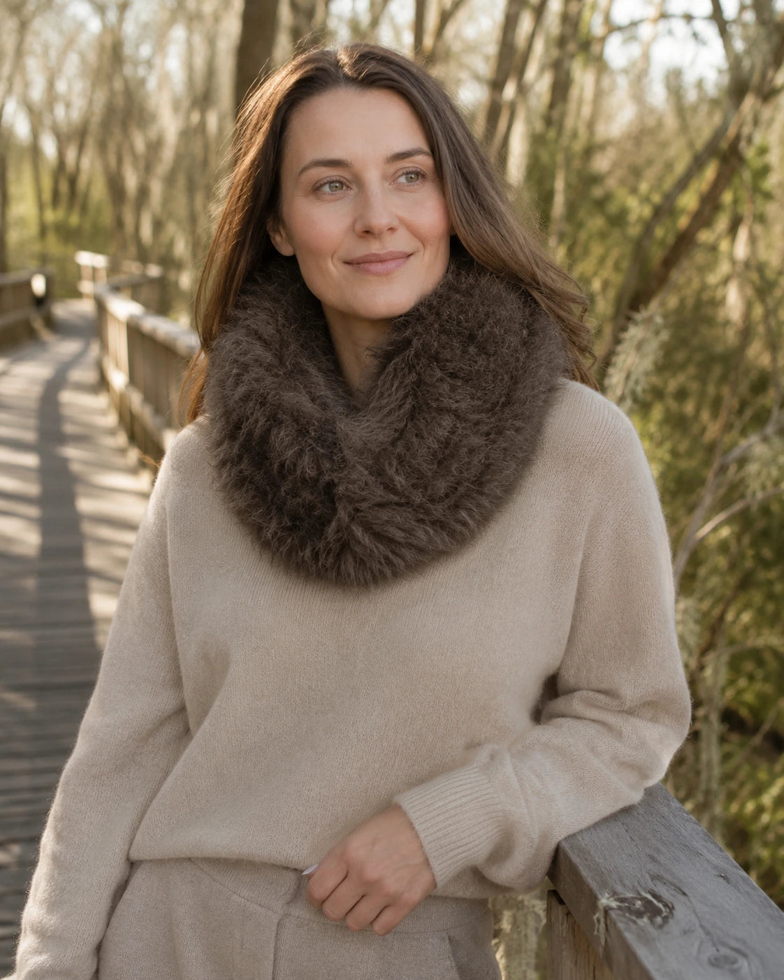 Adult woman wearing a Warm Brown genuine lamb fur magnetic scarf outdoors in dry weather