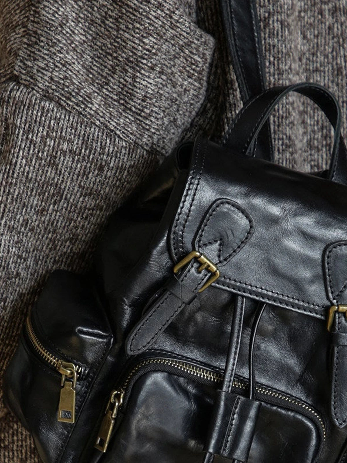 Black leather backpack zipper and hardware detail