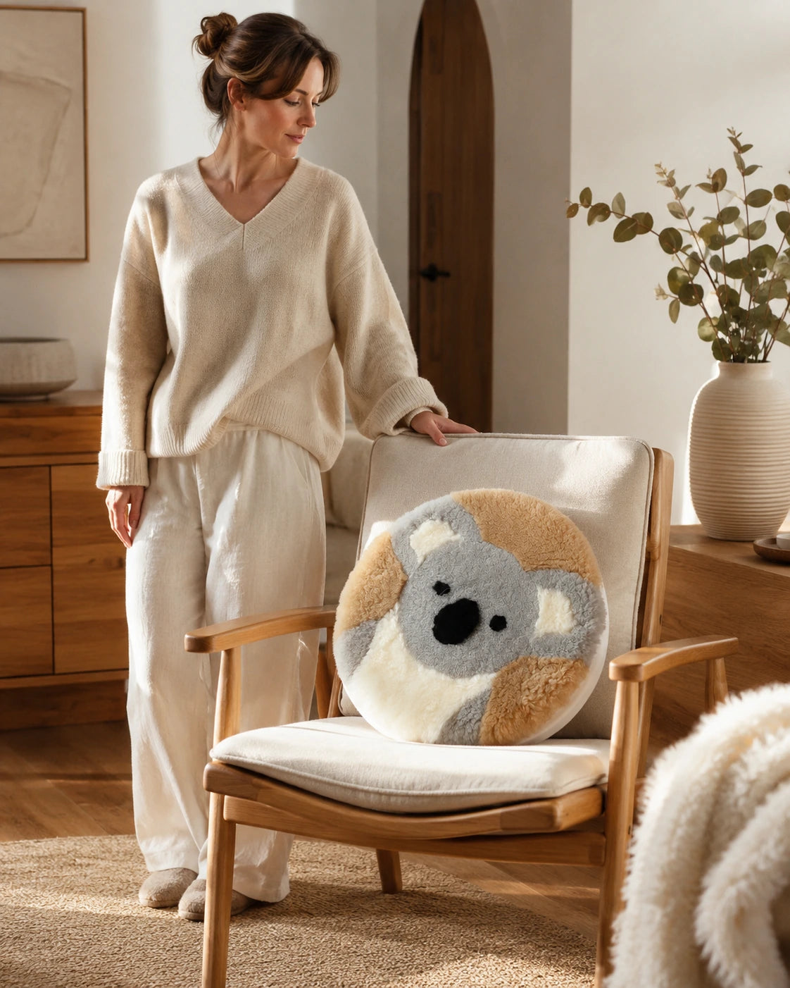 Koala genuine sheepskin round chair pad styled on a lounge chair