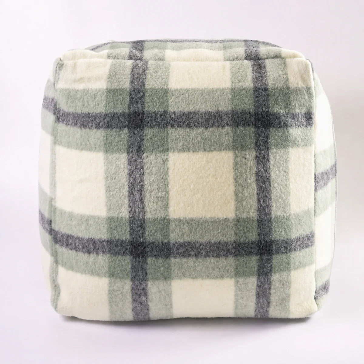 Sage plaid textured floor cushion on a light neutral background