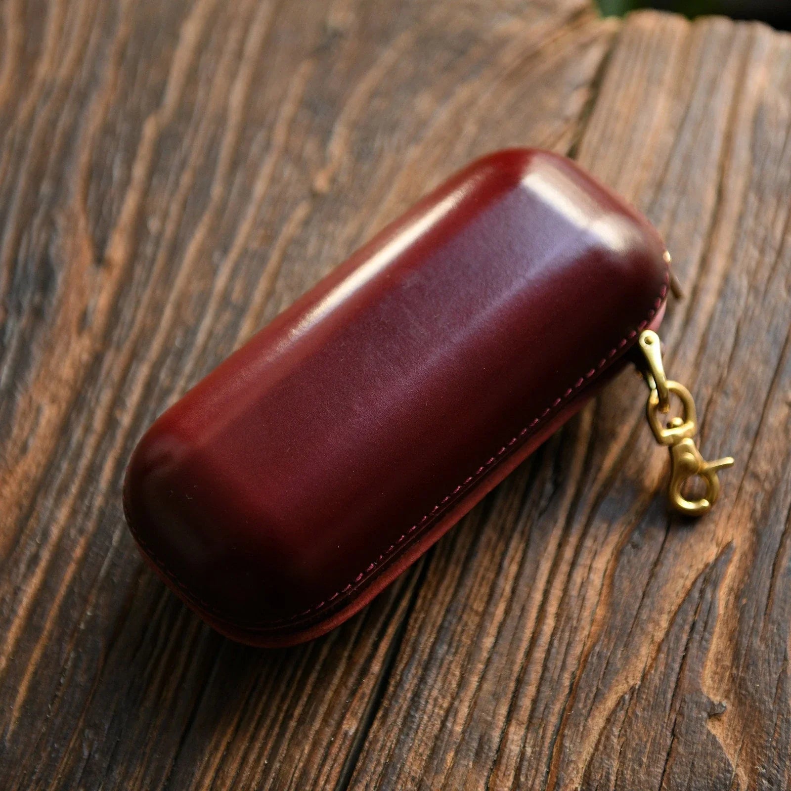 Small burgundy vegetable-tanned leather eyeglass case