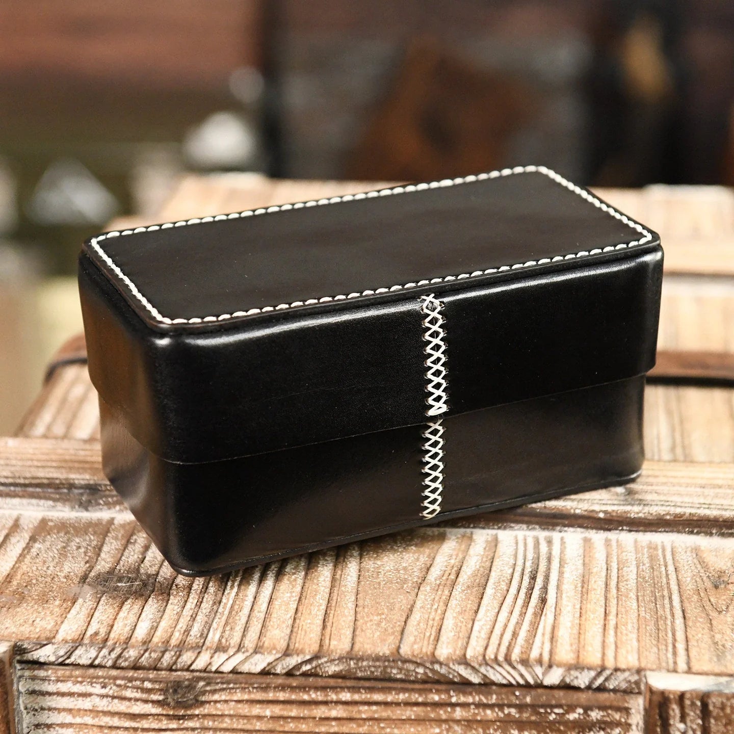 Black handcrafted leather storage box with contrast stitching