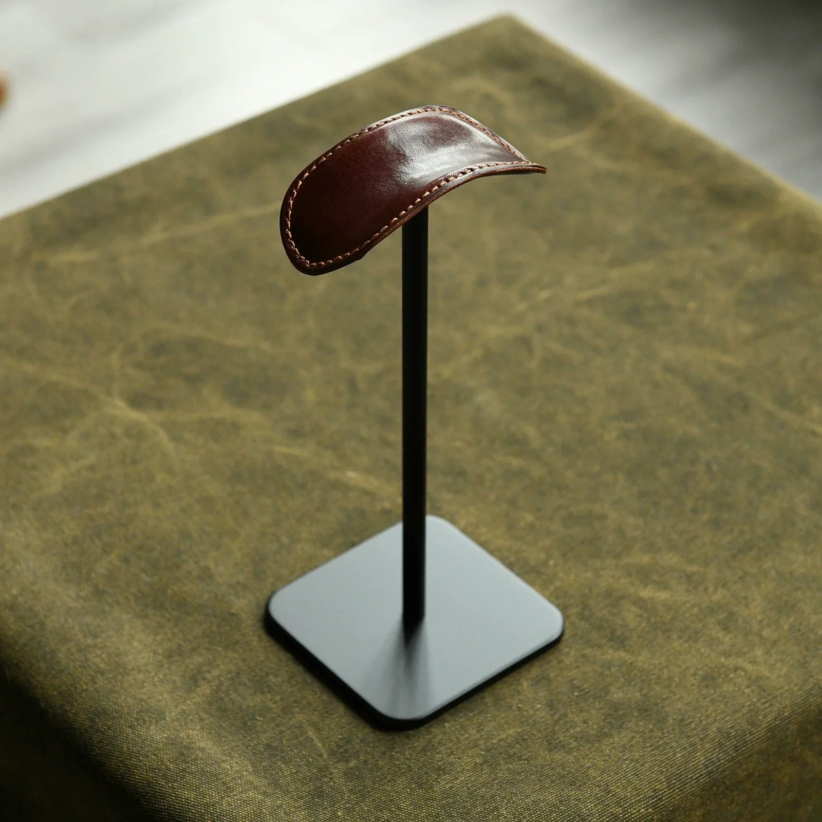 Espresso cowhide and black metal headphone stand