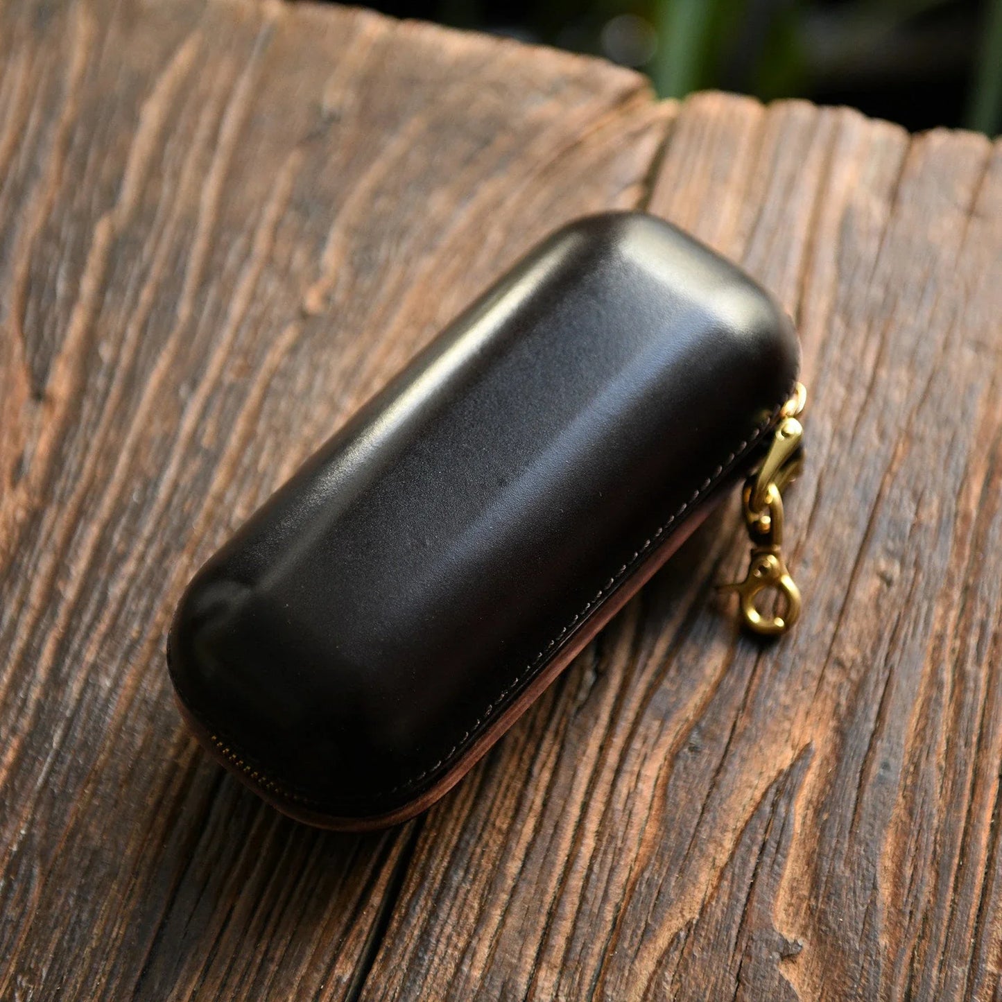 Small dark brown vegetable-tanned leather eyeglass case