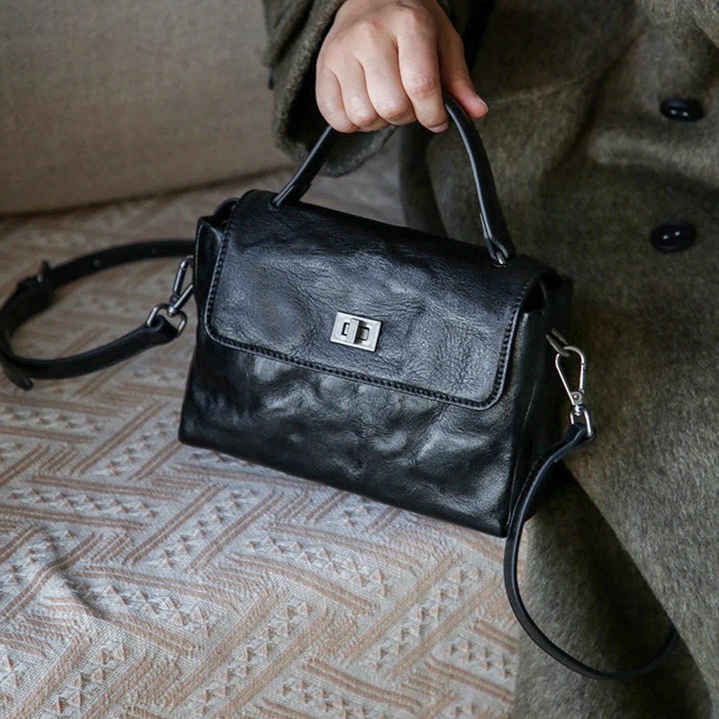Black leather satchel styled for everyday wear