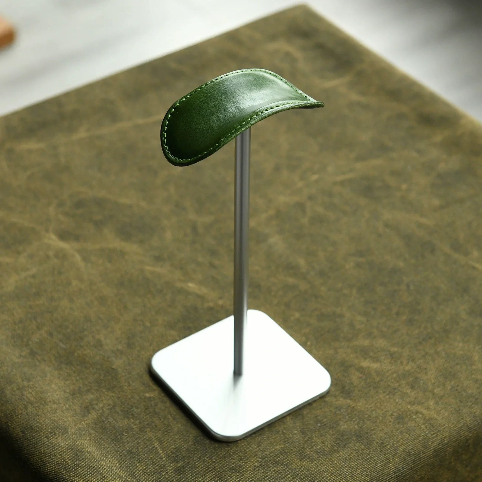 Forest green cowhide and silver metal headphone stand