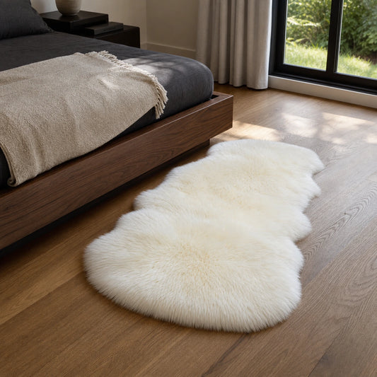 Ivory genuine Australian sheepskin bedside rug in a modern American bedroom