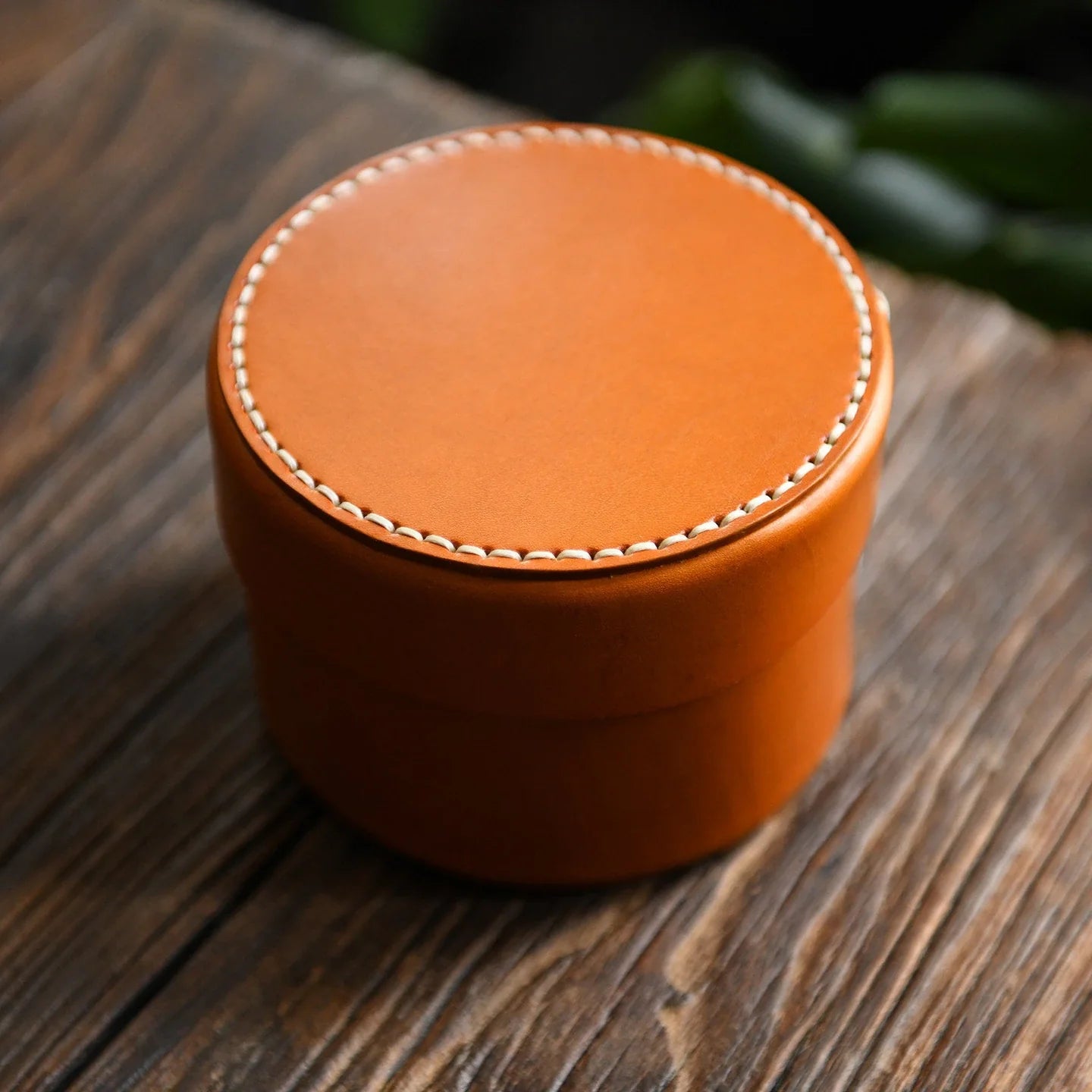 Round brown handcrafted leather storage box