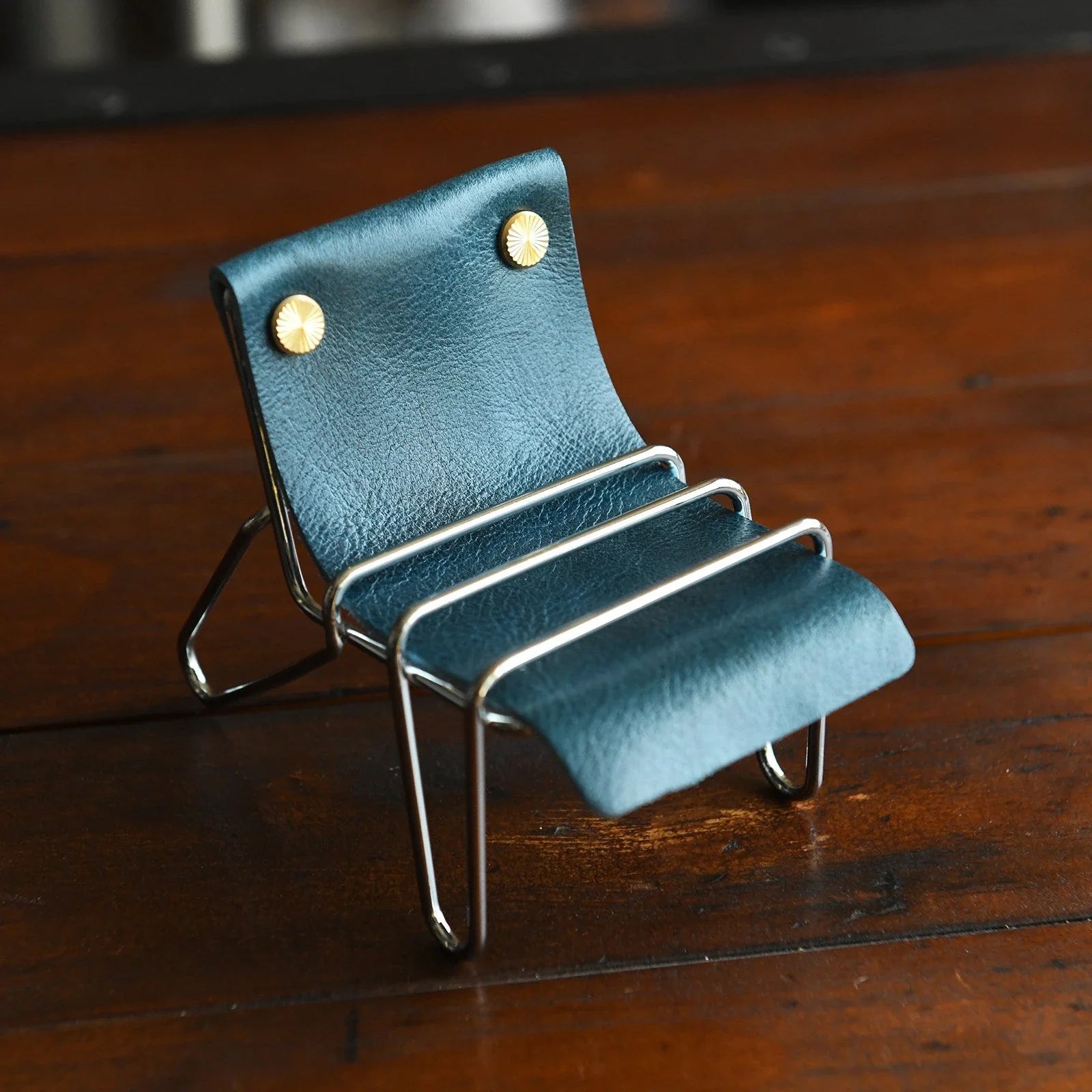 Peacock blue leather phone stand with silver frame