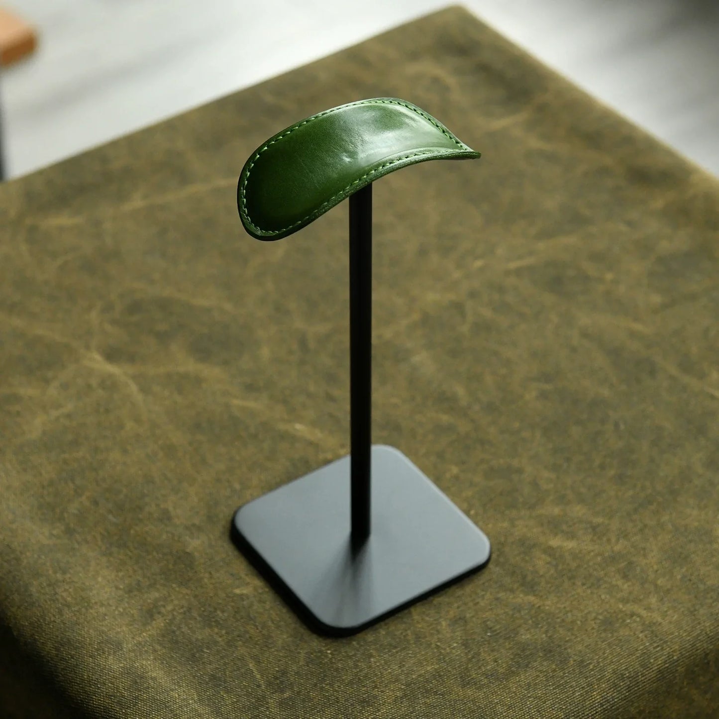 Forest green cowhide and black metal headphone stand
