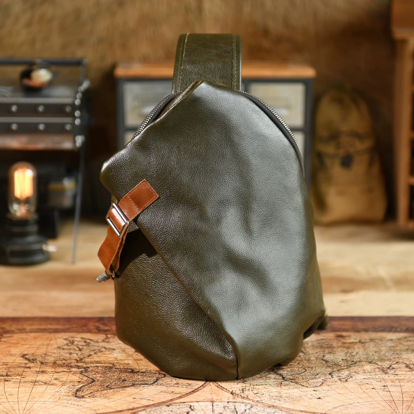 Dark Green cowhide leather sling chest bag, studio product view