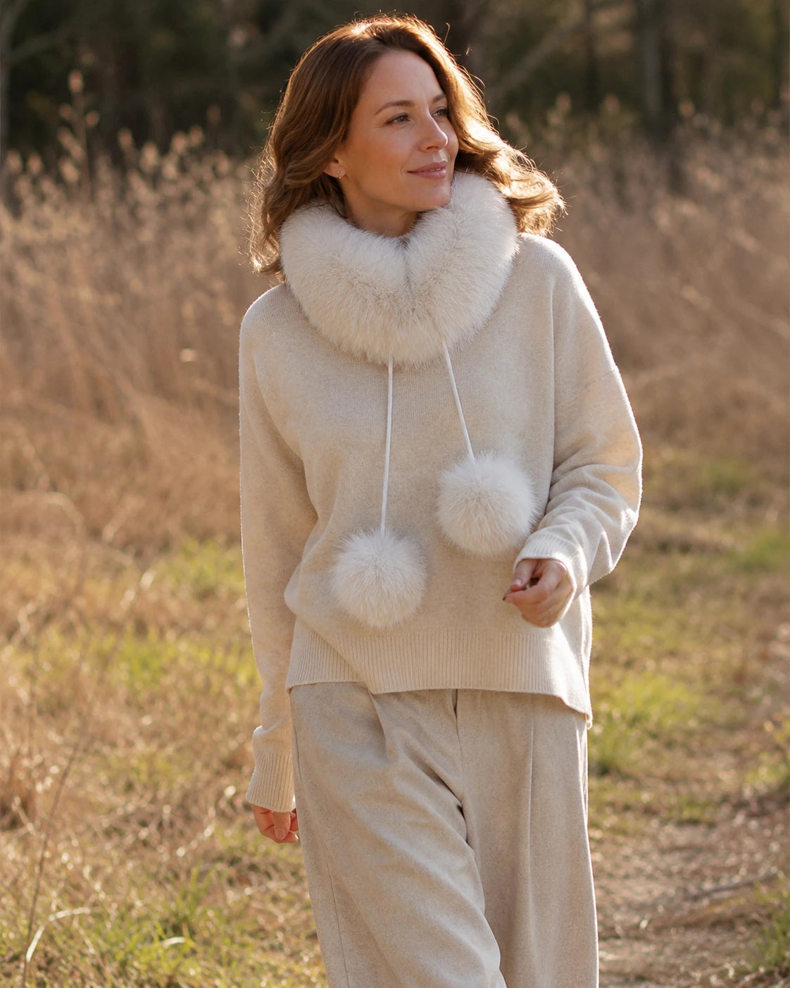 Woman wearing a Light Gray genuine fox fur loop scarf outdoors