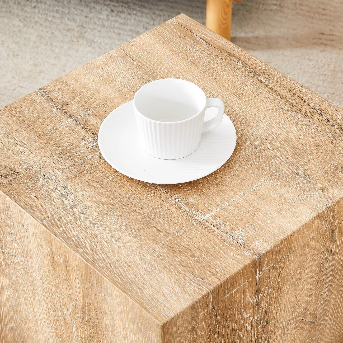 Elevate your living space with this square modern MDF coffee table that showcases smooth, light wood color texture patterns. It is characterized by – view 19