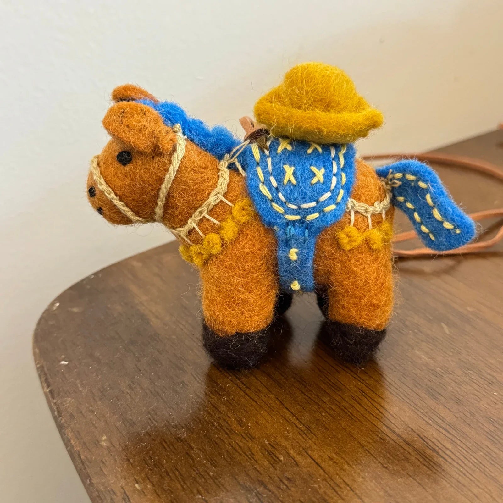 Brown wool felt lucky coin horse charm