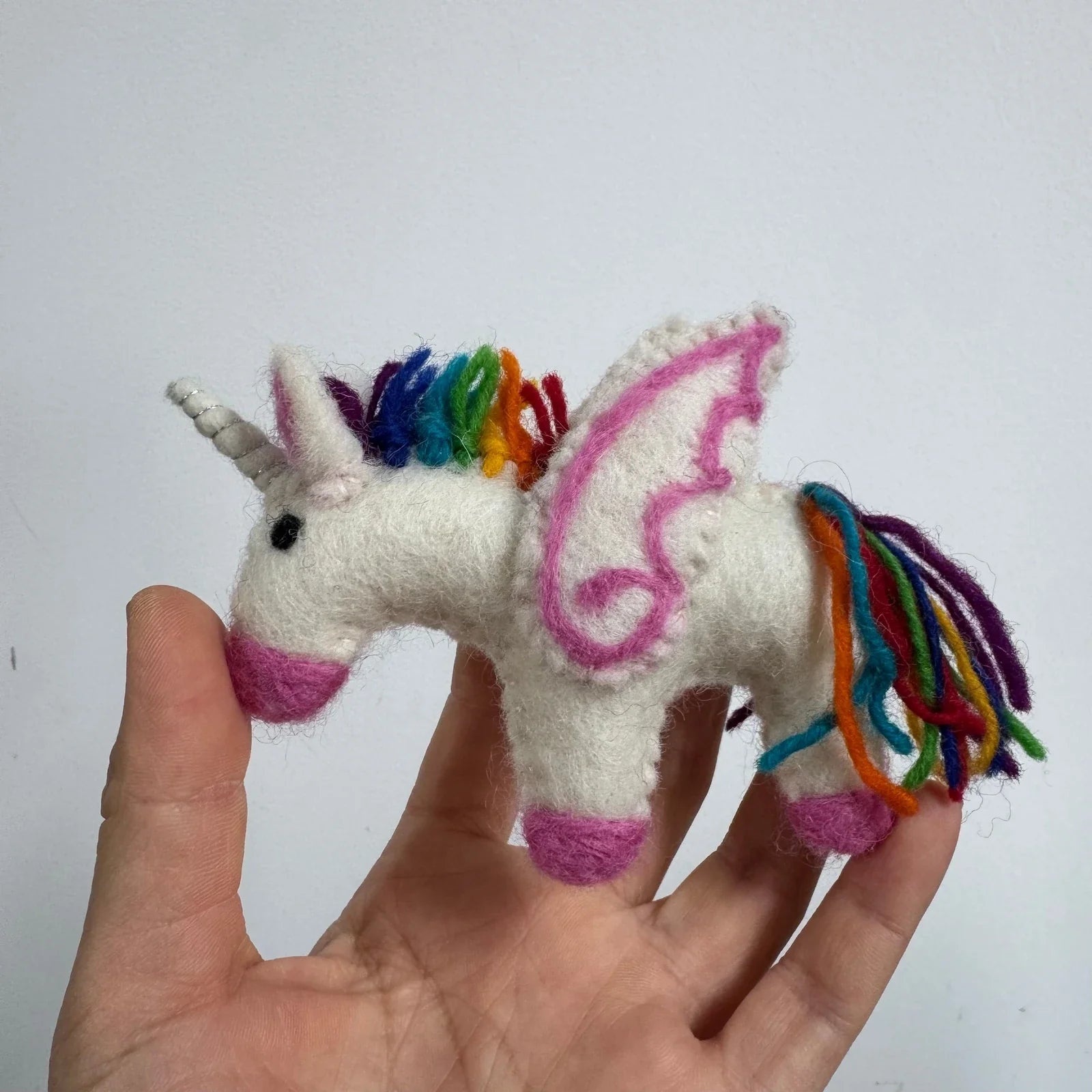White wool felt unicorn charm with rainbow details