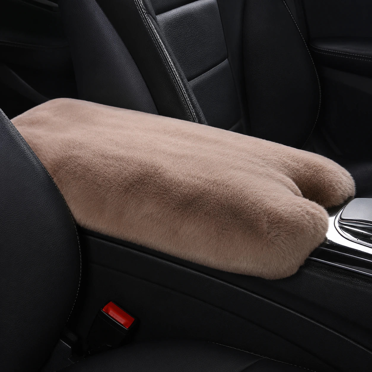 Khaki genuine Rex rabbit fur center console armrest pad installed in a black car interior