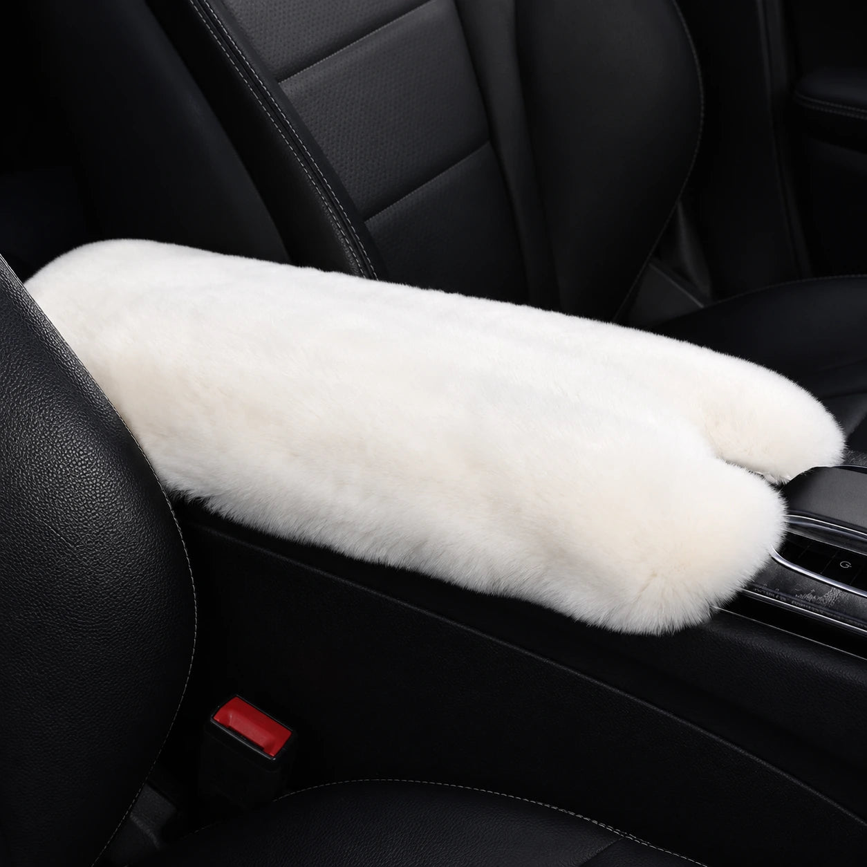 Milky white genuine Rex rabbit fur center console armrest pad installed in a black car interior