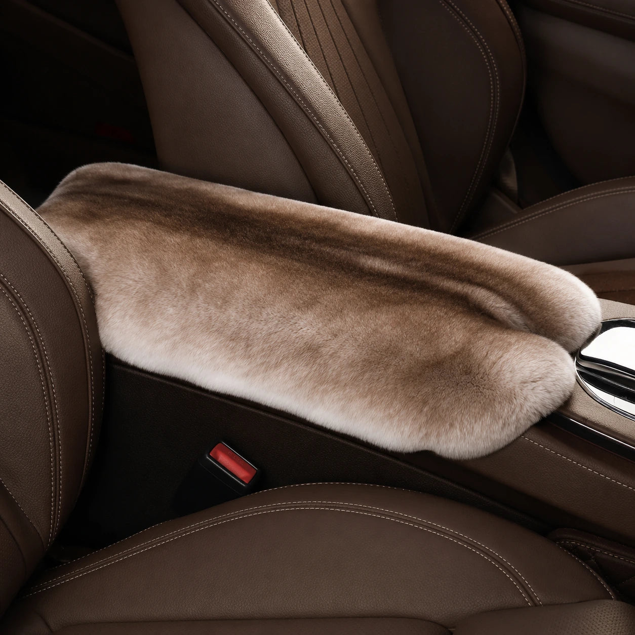 Natural brown genuine Rex rabbit fur center console armrest pad installed in a brown car interior