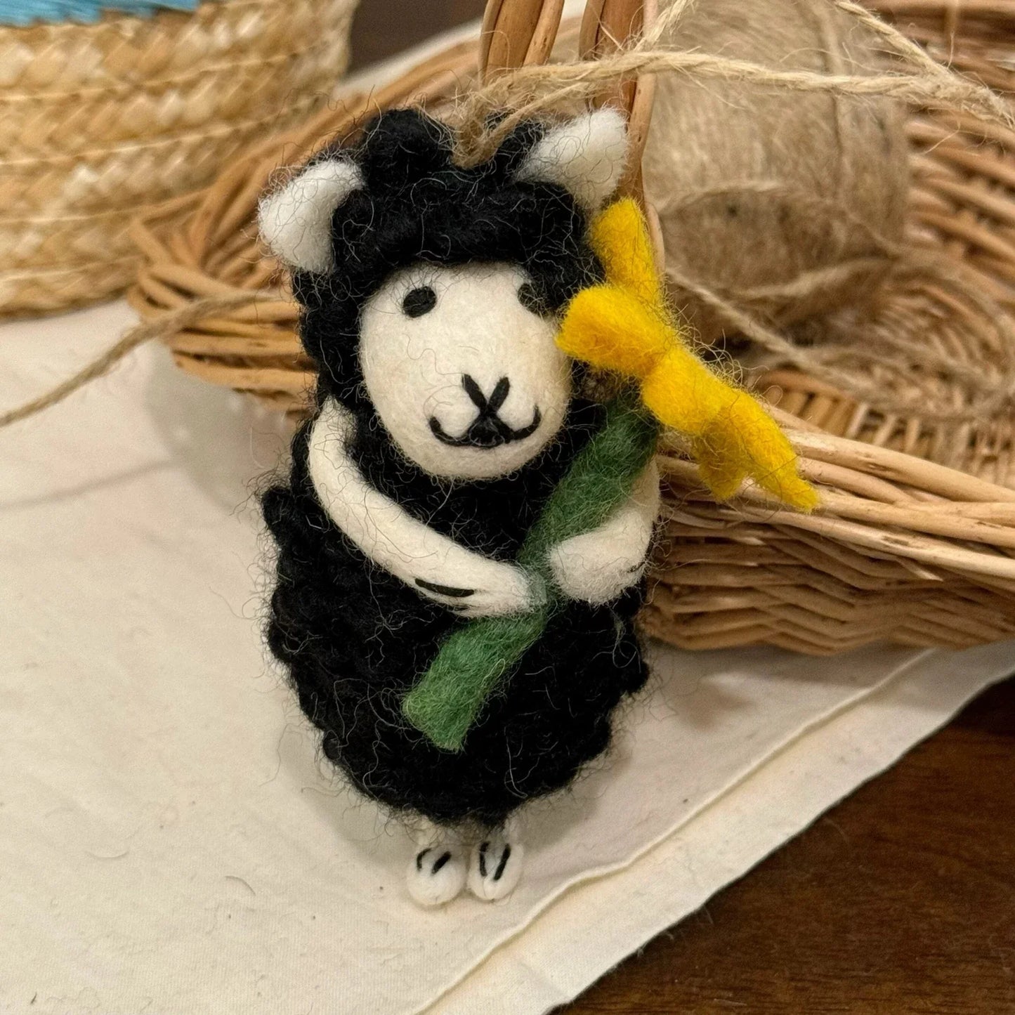 Handmade wool felt sheep bag charm – black sheep with yellow flower
