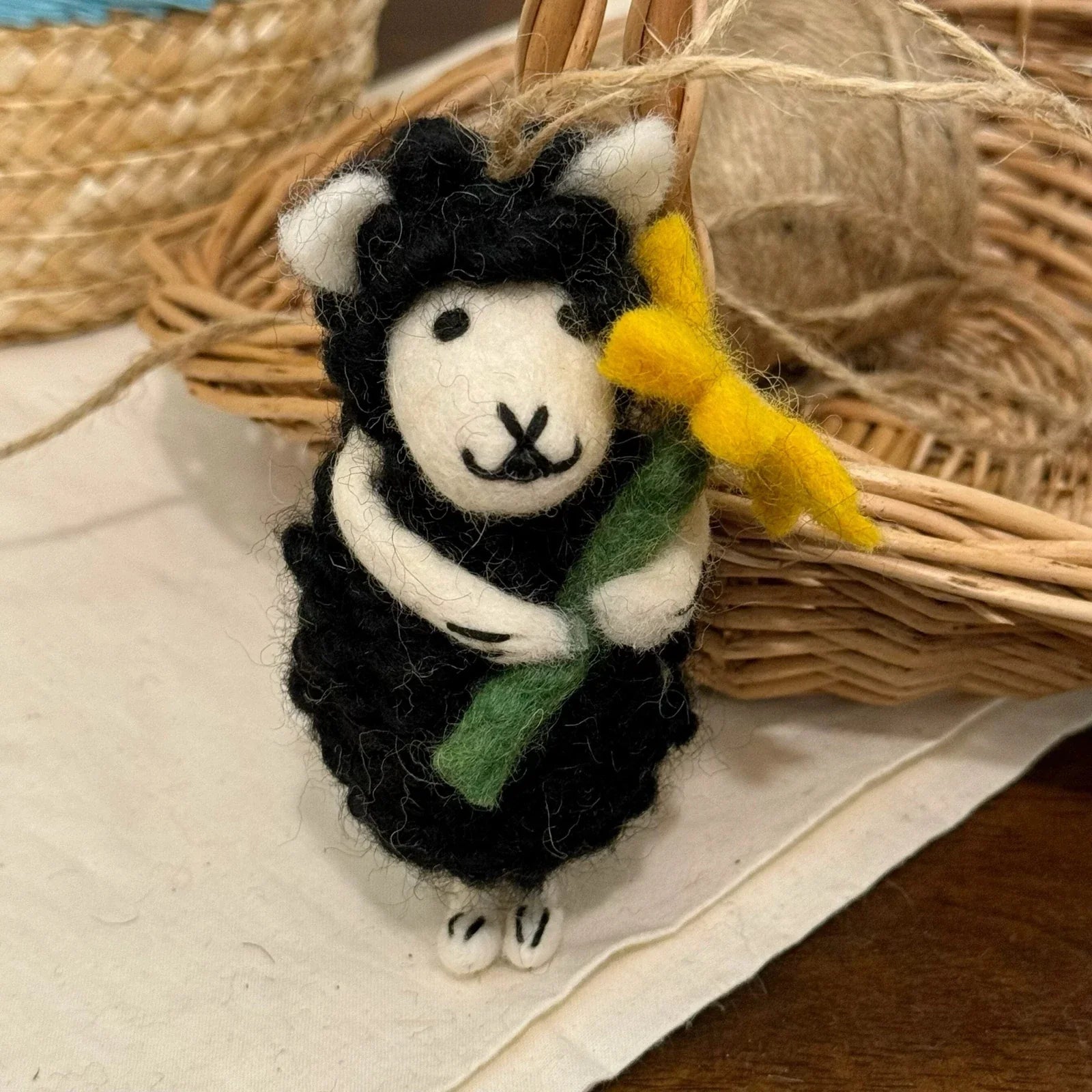 Handmade wool felt sheep bag charm – black sheep with yellow flower