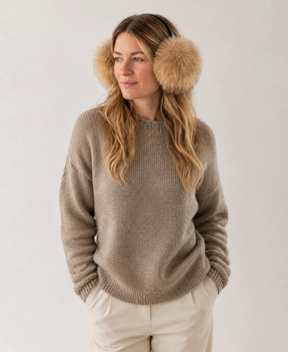 Oversized Genuine Natural Fur Earmuffs - Asiatic Raccoon & Silver Fox – Fur & Color: Asiatic Raccoon - Golden Taupe on-model lifestyle image