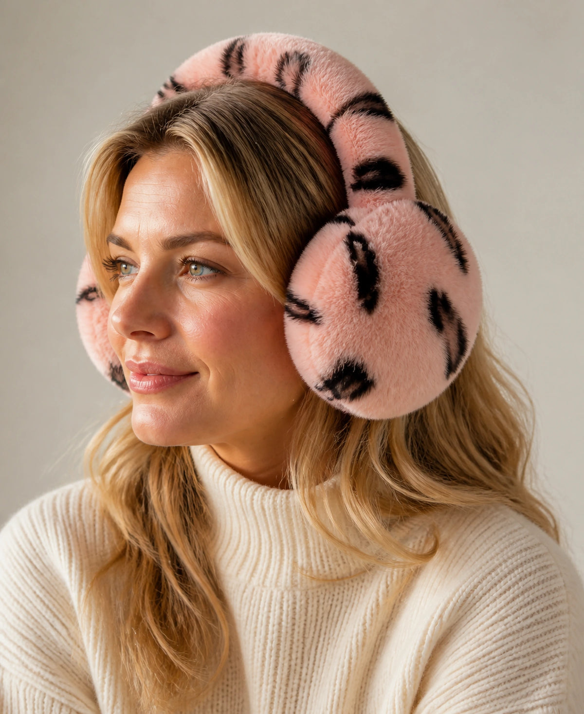 Genuine Rex Rabbit Fur Earmuffs - Adjustable Double-Sided Warmth – Color: Blush Leopard on-model lifestyle image