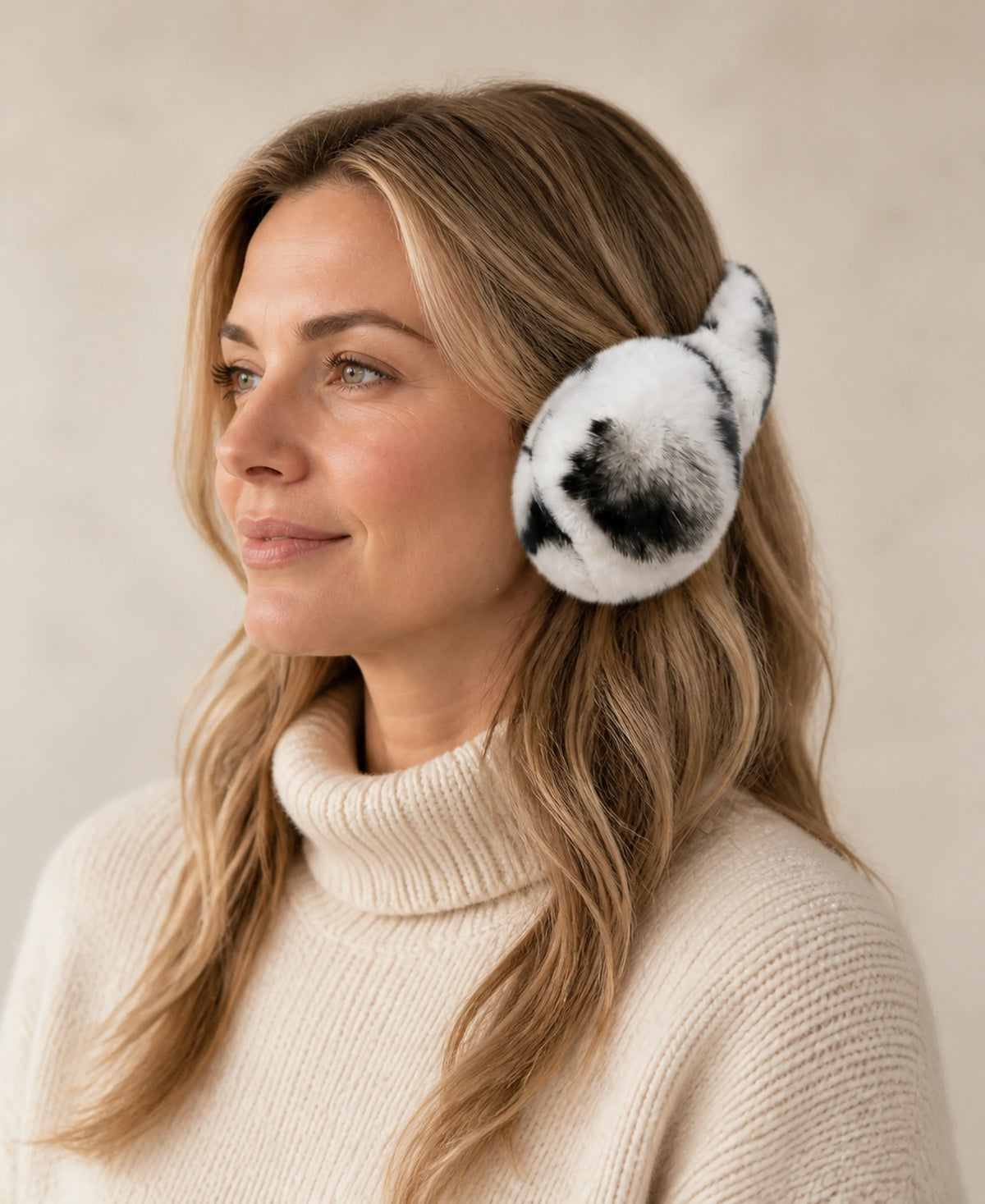 Genuine Rex Rabbit Fur Earmuffs - Adjustable Double-Sided Warmth – Color: Snow Leopard on-model lifestyle image
