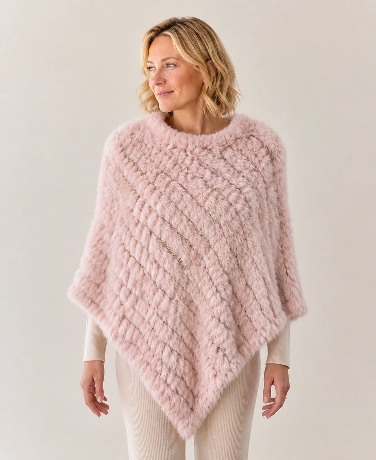 Handwoven Genuine Rabbit Fur Triangle Poncho – Collar Style: Classic Knit Collar | Color: Apricot Pink on-model lifestyle image