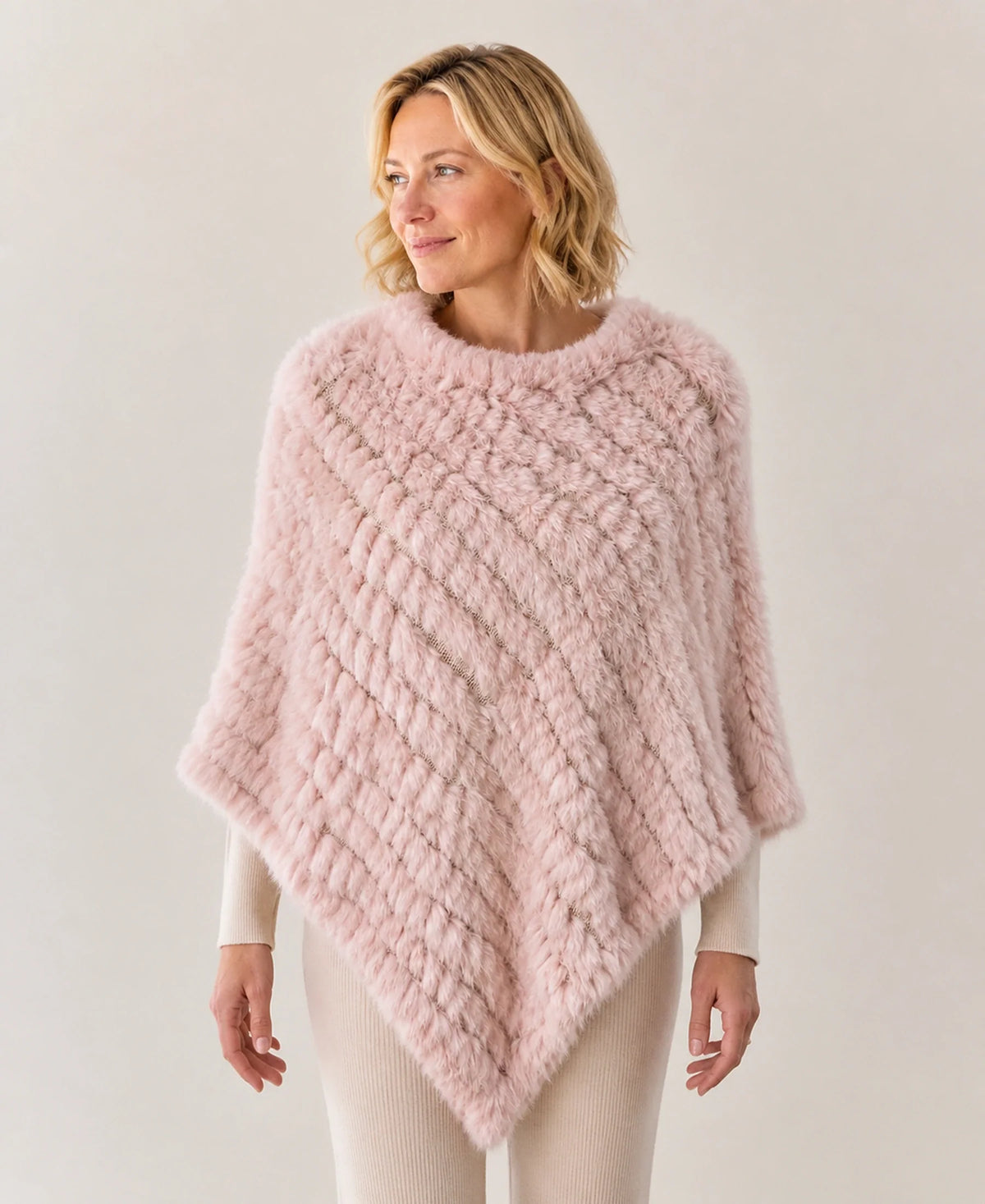 Handwoven Genuine Rabbit Fur Triangle Poncho – Collar Style: Classic Knit Collar | Color: Apricot Pink on-model lifestyle image
