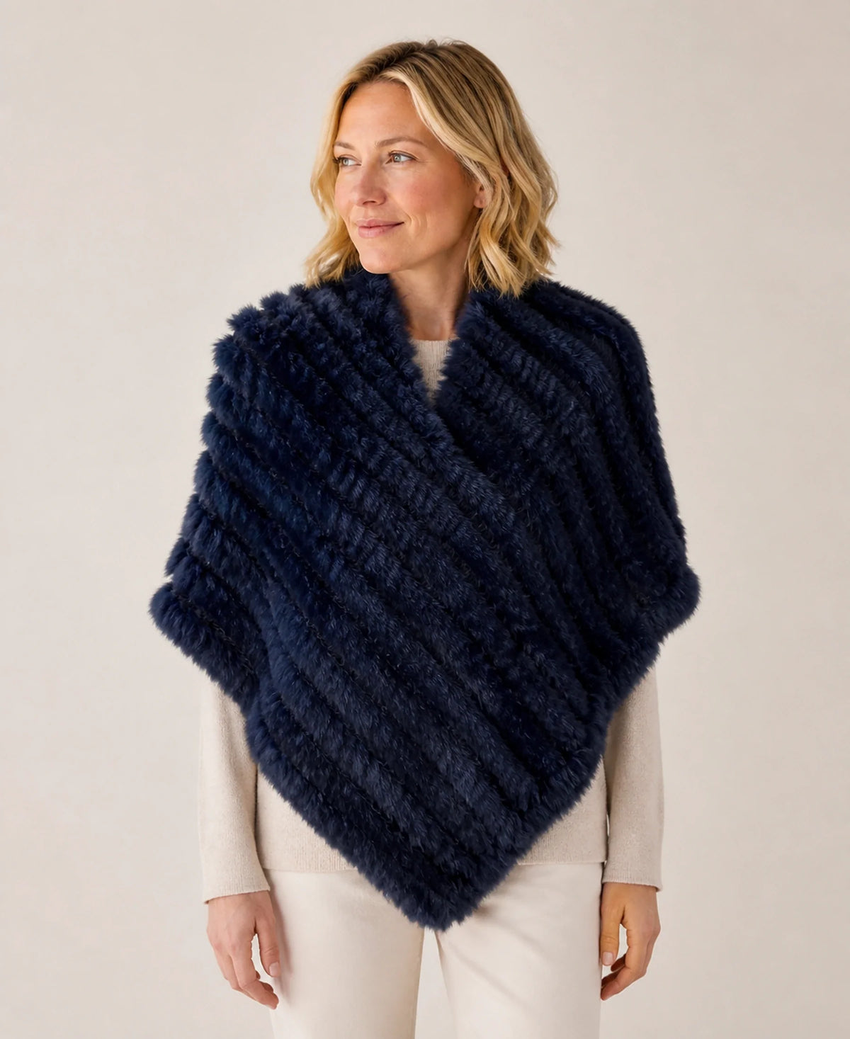 Handwoven Genuine Rabbit Fur Triangle Poncho – Collar Style: Raccoon Fur Collar | Color: Navy Blue on-model lifestyle image