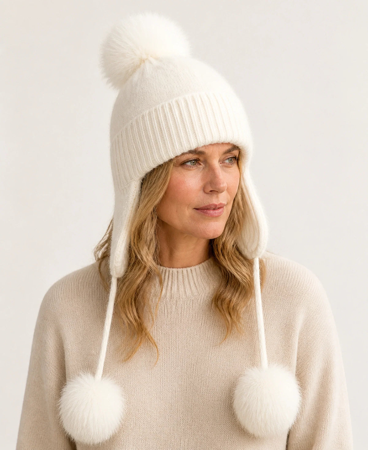 Women's Fox Fur Pom-Pom Knit Earflap Trapper Hat – Color: Beige on-model lifestyle image