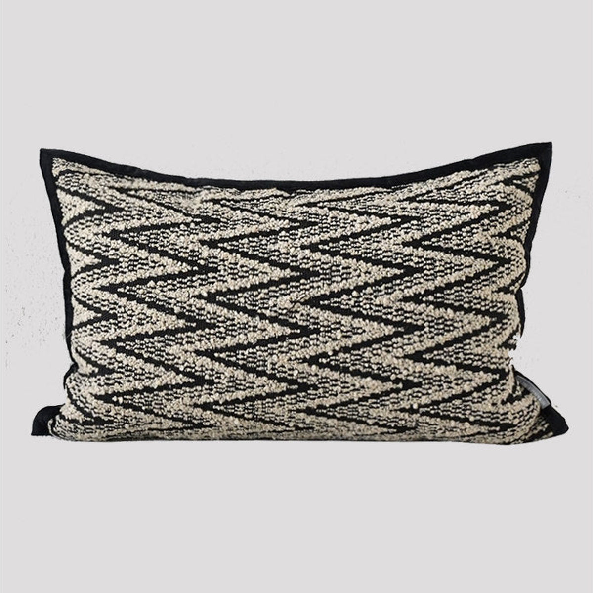 Black and brown lumbar herringbone cushion