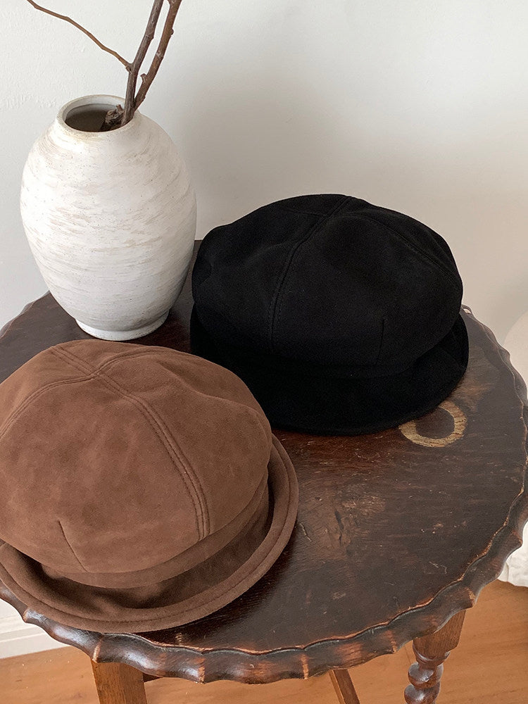Black and Brown paneled beret caps displayed together
