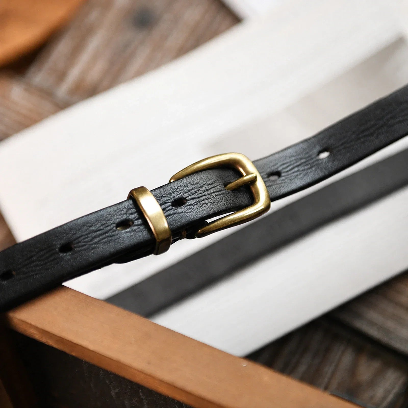 Black cow leather belt with copper single-prong buckle