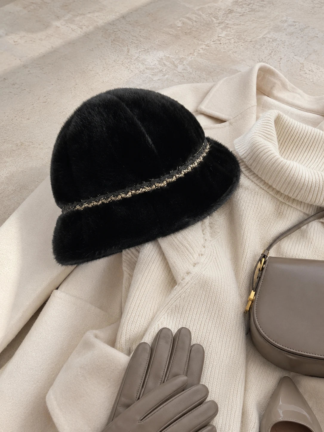 Natural Black genuine mink fur bucket hat styled in a winter flat lay