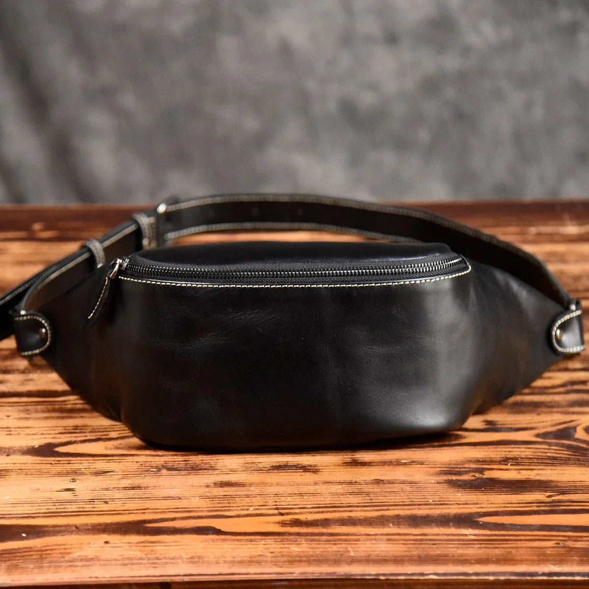 Black top-grain leather sling bag